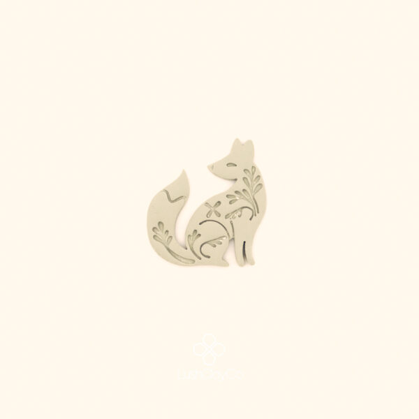Clay impression of the Rävna Fox wildlife cutter showing seated fox form with woven botanical and floral interior detail pressed into polymer clay