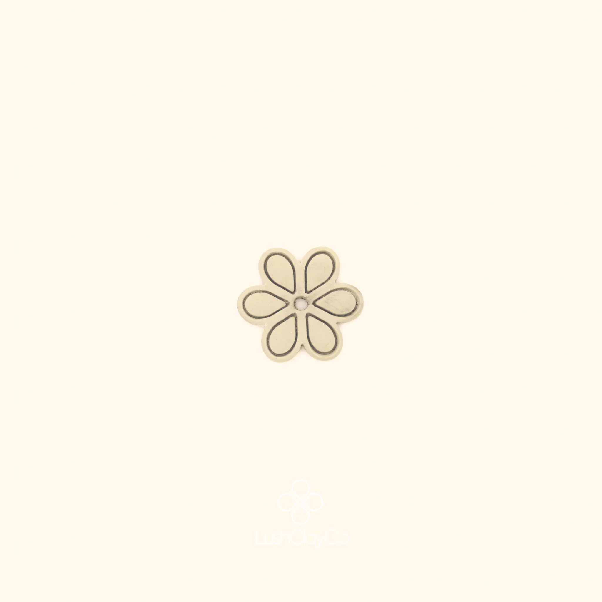 Clay impression of the Altı Penç ottoman floral cutter showing six rounded petals with inner contour lines pressed into polymer clay