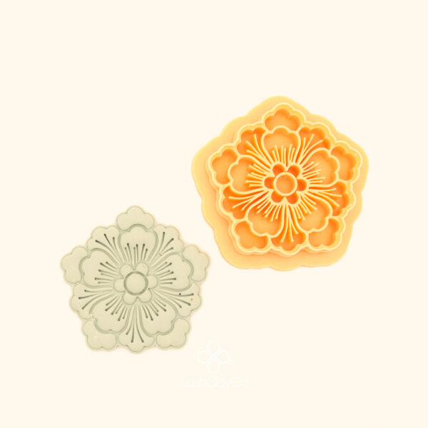 Şahane Deste botanical polymer clay cutter alongside clay impression showing large multi-petalled rosette with scalloped outer petals and radiating centre detail