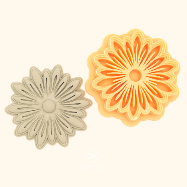 Yıldız Zinnia floral polymer clay cutter alongside clay impression showing two rings of elongated pointed petals radiating from a circular centre