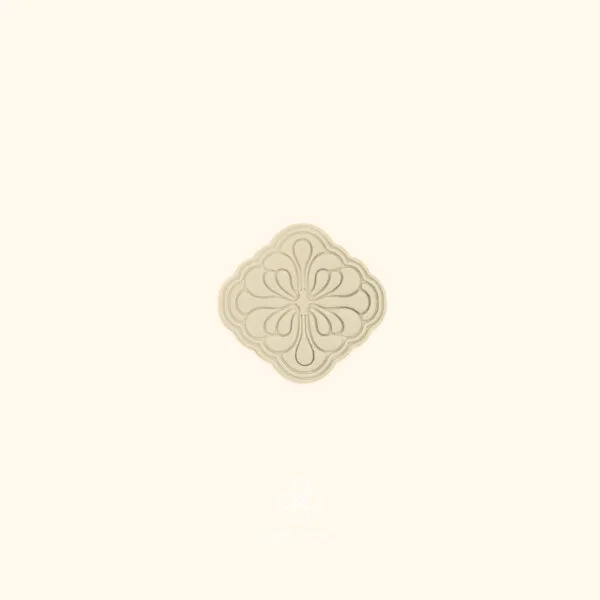 Clay impression of the Gül Daire turkish rose cutter showing four-way symmetrical medallion composition with teardrop and stem elements pressed into polymer clay