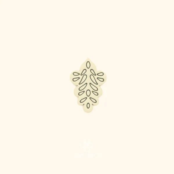 Clay impression of the Gül Motif ottoman rose cutter showing open branching teardrop and oval forms pressed into polymer clay within a diamond silhouette