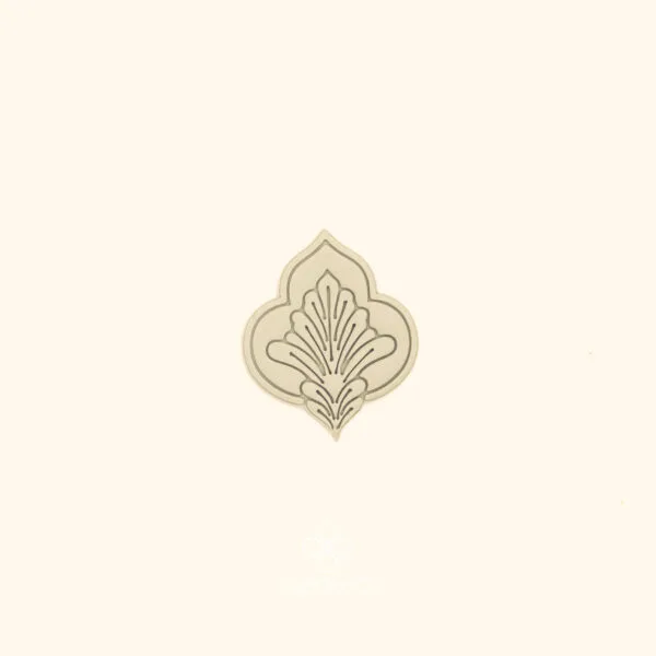 Clay impression of the Karanfil Scroll ottoman cutter showing carnation interior with fine radiating lines pressed into polymer clay within a pointed ogival form