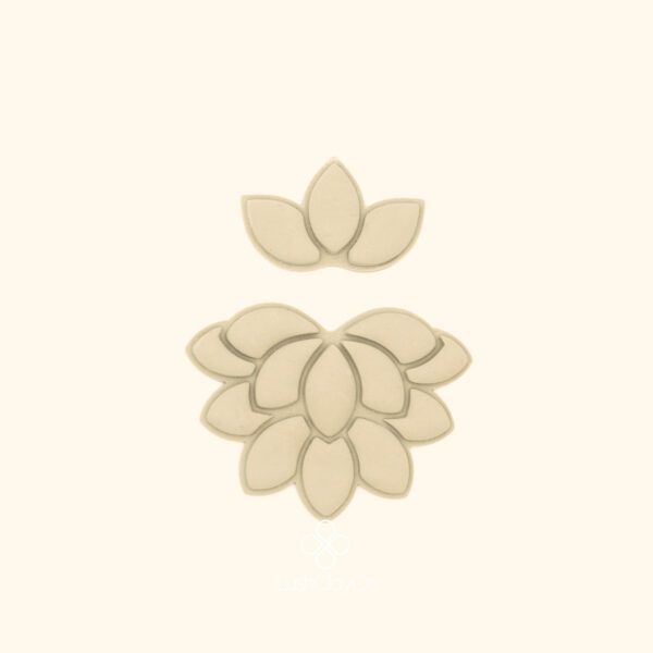 Clay impressions of the Nilüfer Deste botanical cutter set showing tiered lotus bloom and three petal crown form pressed into polymer clay