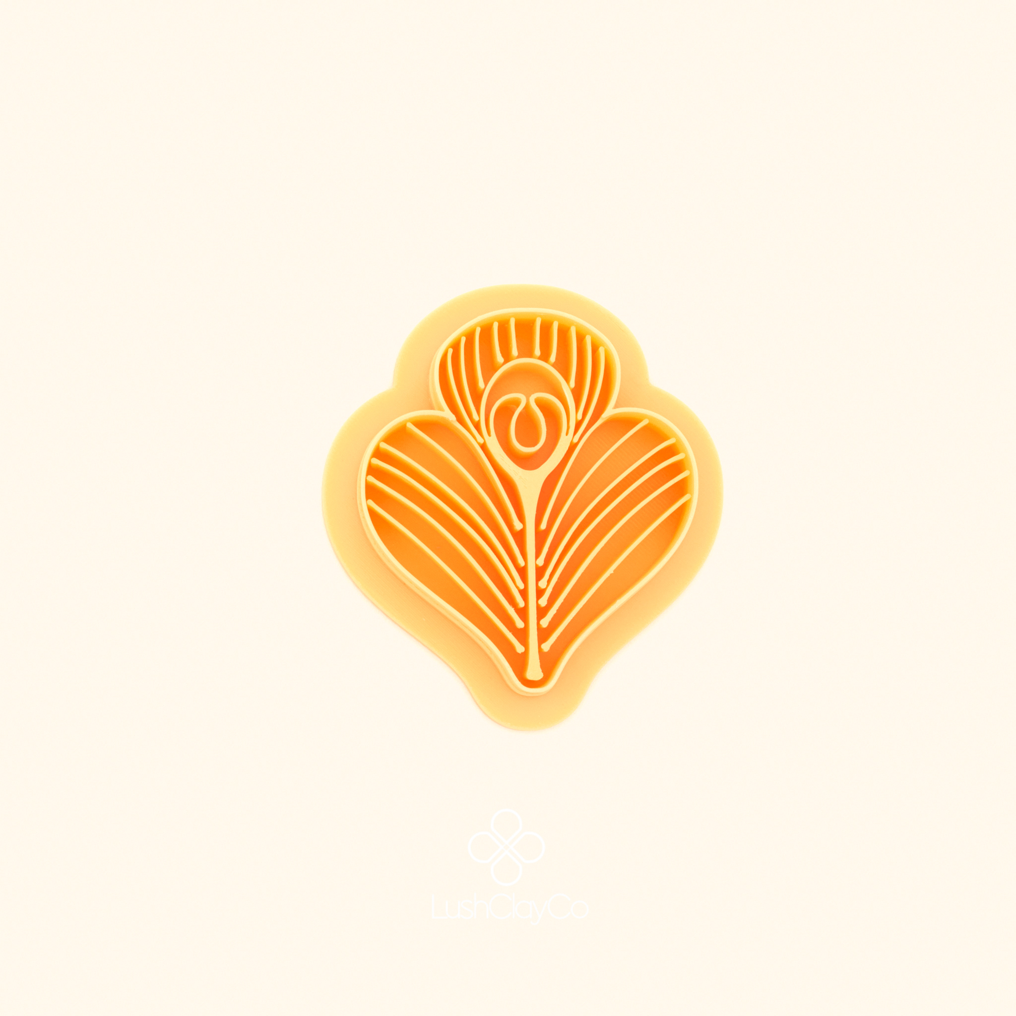 Tavus Tüyü polymer clay cutter showing wide heart outer form with three lobed top edge and full surface feather line detail