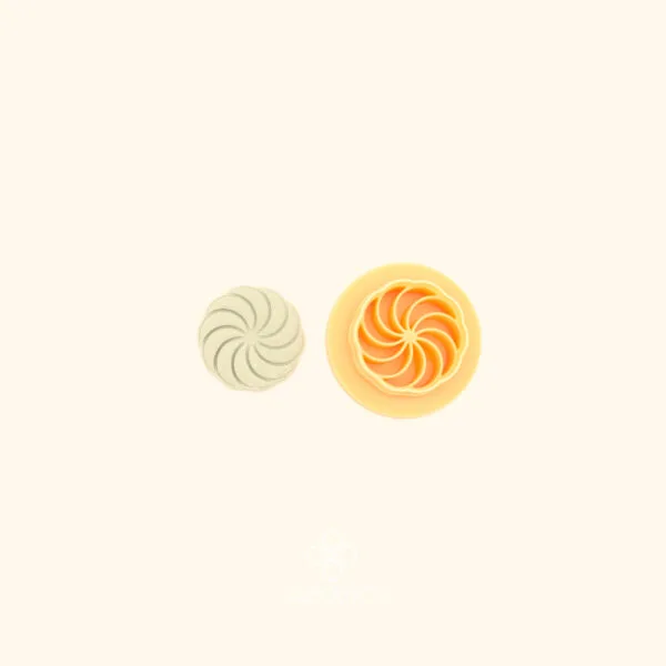 Çarkıfelek ottoman polymer clay cutter alongside clay impression showing small circular form with curved spiral petal arms radiating from a central point