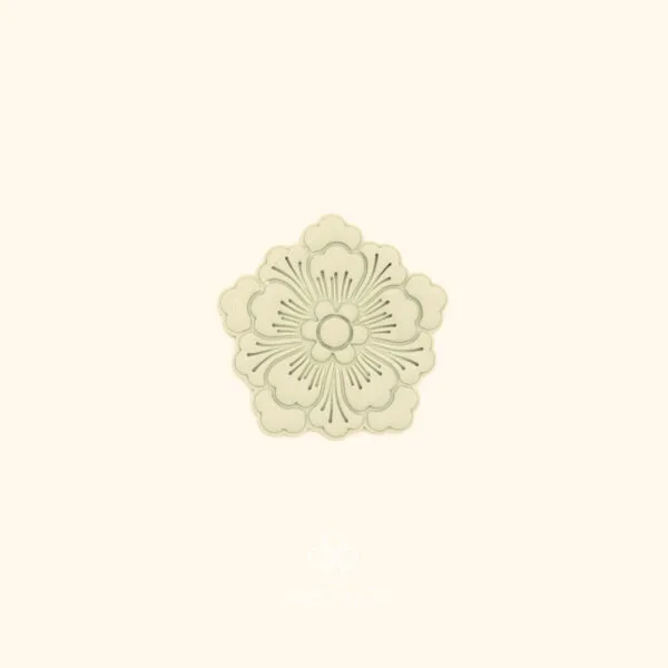 Clay impression of the Şahane Deste botanical cutter showing full rosette composition with fine radiating lines pressed into polymer clay