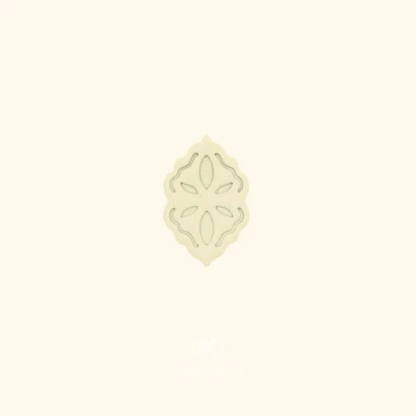 Clay impression of the Sırma Nakış ottoman cutter showing four-way symmetrical floral cross with clean teardrop petals pressed into polymer clay