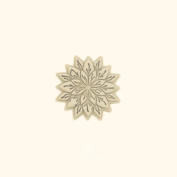 Clay impression of the Sultan Flora hatayi cutter showing two rings of detailed pointed petals and fine interior linework pressed into polymer clay