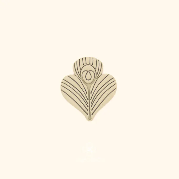 Clay impression of the Tavus Tüyü peacock feather cutter showing dense parallel radiating lines and central oval eye pressed into polymer clay