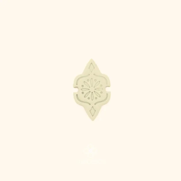 Clay impression of the Telkari Frame turkish filigree cutter showing eight-pointed star compass rosette and dot work pressed into polymer clay