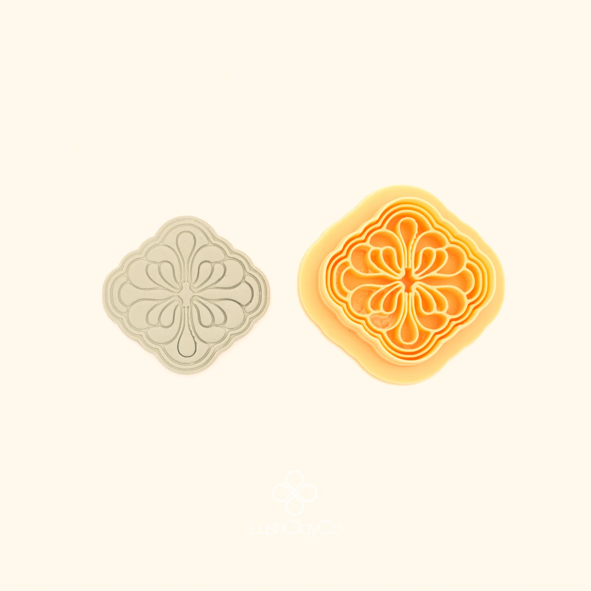 Gül Daire turkish rose polymer clay cutter alongside clay impression showing concave sided square form with four-way symmetrical rose and scroll interior