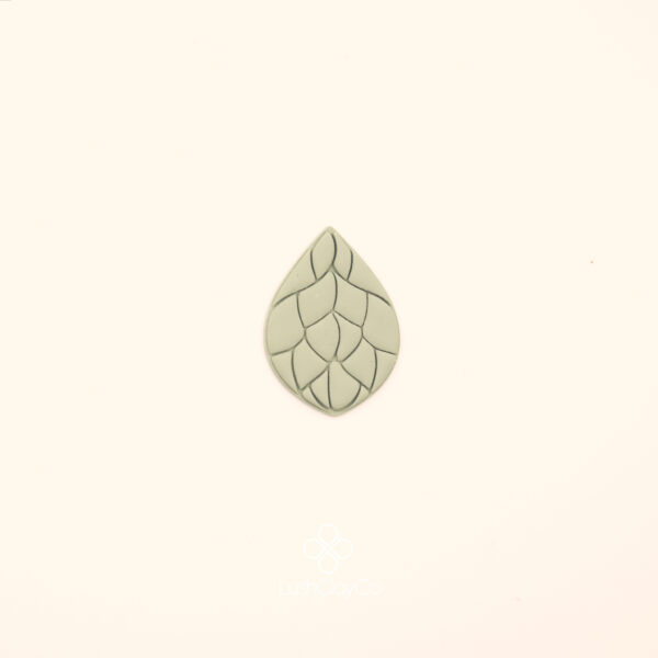 Damla Ottoman Rumi Cutter Clay impression of the Damar Damla rumi cutter showing broad curved vein sections pressed into polymer clay within a teardrop silhouette