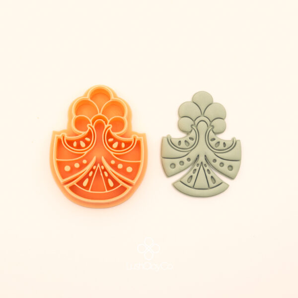 Karpuz Umut ottoman polymer clay cutter alongside clay impression showing dome arch silhouette with watermelon slice forms, dot clusters and botanical crown