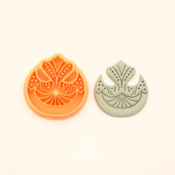 Tuba ottoman polymer clay cutter alongside clay impression showing dome arch silhouette with fan palmet base, wing forms and dotted berry clusters