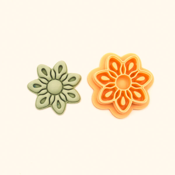 Papatya polymer clay cutter and its clay impression, a six-petal daisy flower