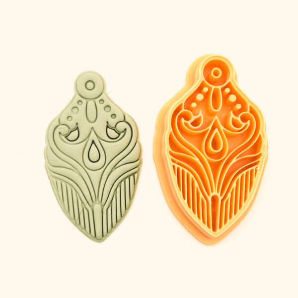 Şebnem polymer clay cutter and its clay impression, a symmetric teardrop pendant design