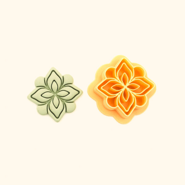 Zambak polymer clay cutter and its clay impression, a four-petal lily medallion